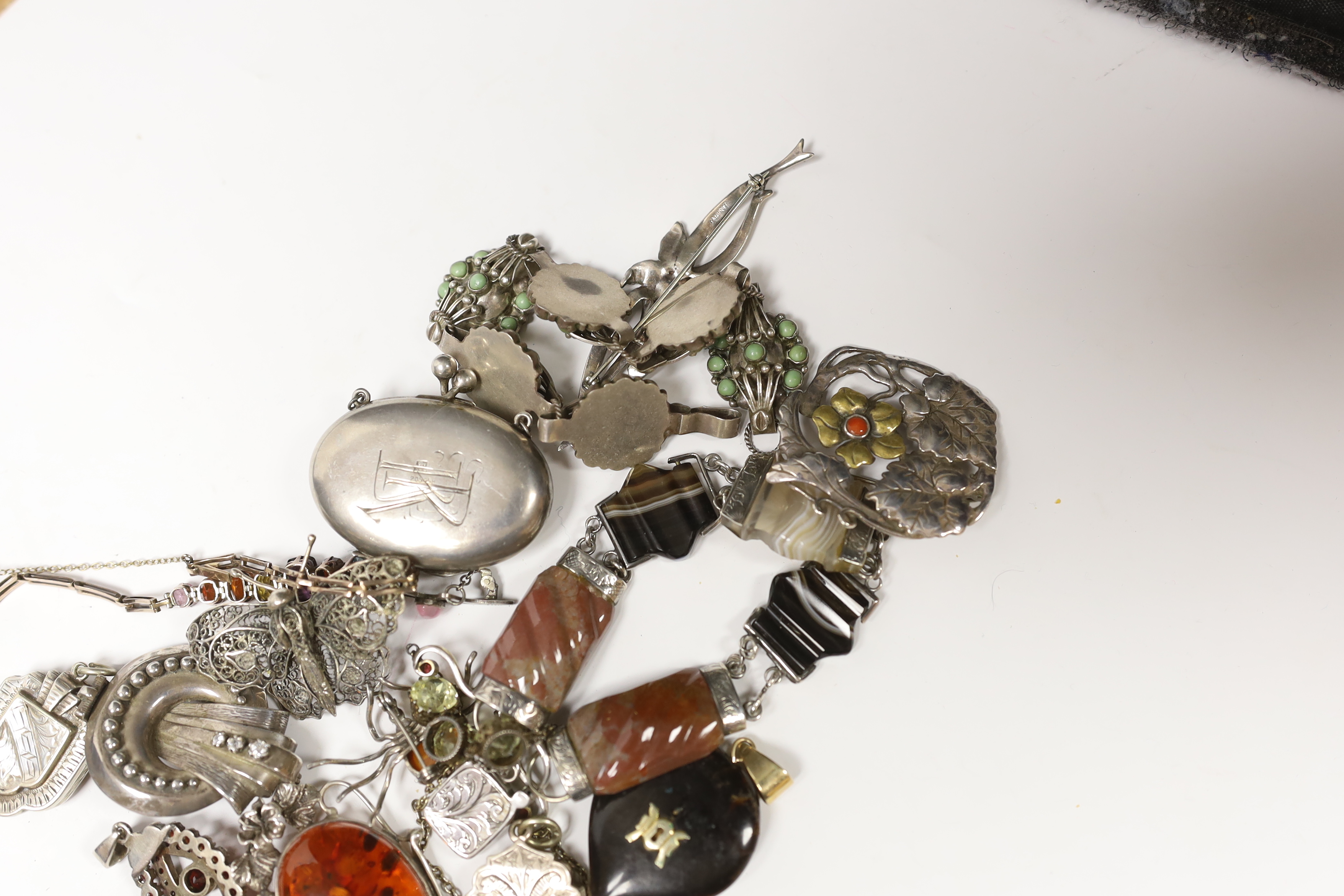 A small quantity of Victorian and later jewellery, including white metal and agate set bracelet, a yellow metal and graduated multi gem set bracelet (including zircon and garnet), lockets, brooches, etc.